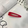Detail of red handmade duckbill hair clip with France engraving on aesthetic book background - Red Drop-shaped Duckbill Clip