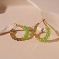 Detail of geometric hoop earrings with green crystals and gold beads on stone - Silver Needle / Green Crystal Hoop Earrings (HE20066)