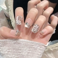 Detail of handmade press-on nails with cat-eye finish, 3D floral art, pearls and rhinestones - Extra Small (XS) / Ultra Short Coffin