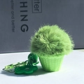 Green plush ball keychain in a mini potted plant design with star charm accessory - Potted Grass Pendant