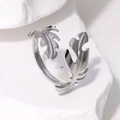 Minimalist silver leaf stainless steel open ring displayed on white textured stone - Adjustable Open / Silver