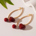 Detail of vintage gold curved earrings with heart-shaped dark red resin pendants - Silver Earring Post - Red Resin Heart Round Ball Drop Earrings
