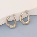 Macro detail of irregular silver geometric earrings with fluid lava textured design - Silver Style K7-60