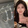 Close-up and model view of silver hoop earrings with rectangular baguette crystals - A1448 Silver