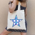 Beige canvas tote bag with Greek Evil Eye star print worn over the shoulder - STD1804-O Filled Star Evil Eye