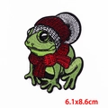 Detailed view of frog embroidery patch with winter hat and scarf, size 6.1x8.6cm - 6.1x8.6cm