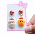 Detail view of cute Santa and yellow star clip-on earrings for kids on a card - 5# Asymmetric Santa & Star / Clip-on Earrings Pair