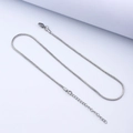 Detail of silver snake chain necklace featuring lobster clasp and extension link - 40+5cm / 1.2mm Square Snake Chain / Steel