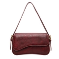 Retro red leather underarm bag with unique curved base and gold hardware accents - Red