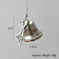 Silver Christmas bell ornament with angel wings and heart pendant on white background - Angel Bell