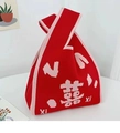 Red knit knot bag with pink Double Happiness motif and decorative braided texture - Red with Gold Double Happiness Print