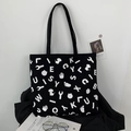 Grande borsa tote in tela nera con stampe grafiche bianche e lettere per donne moderne - Stampa Impronta SY Fronte-retro
