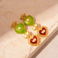 Macro detail of vintage palace-style earrings with red and green enamel hearts and pearls - Silver Needle Multi-color Heart Earrings