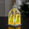 Close-up of a white Christmas lantern with warm LED light and festive tree illustration - Christmas Tree