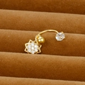 Macro shot of gold-plated C-shape cartilage stud with sun-shaped zircon pendant - Sun Design Style (Y20370-5)