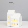 Detail of white ceramic LED house lamp with warm light glowing through windows - RH2274 (7.5x6x9.6cm)