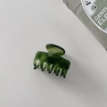 Detail view of a premium deep green translucent acetate hair claw clip on white backdrop - Small Size 4