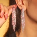 Luxurious silver tassel earrings featuring gradient pink and clear rhinestones on a model - 3D Style / Pink White Gradient