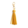 Yellow leather tassel keychain with gold metal lobster clasp on white background - With Lobster Clasp / Turmeric
