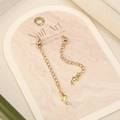 Macro detail of 18k gold dolphin pendant extender chains with lobster clasps - No.3 Gold Plated Dolphin