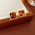 Detail of vintage square resin earrings in amber on a rustic wooden jewelry tray - Steel Pin - Brown - Square