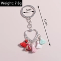 Macro shot of heart fringe keychain showing 11cm length and colorful tassels - Heart Tassel