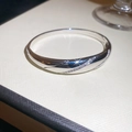 Macro detail of silver bangle featuring cubic zirconia inlay and starry light reflection - Polished Arc With Zirconia (6#)
