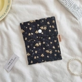 Black floral fabric sanitary napkin pouch with yellow blossoms and a white button - Black Apricot Floral