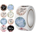 Roll of assorted floral Thank You stickers featuring various elegant round flower designs - Multiple Floral Text