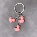 Pink resin duck keychain with silver ring and three cute duckling charms for bags - 3-Piece Set / Pink
