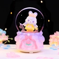 Pink musical snow globe featuring a winged rabbit with crown and floral relief base - 8521 Pink Base / Medium 80# LED Light+Music