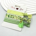 Three-piece set of avocado green hair ties with prints and charms on a Sweet Girl card - Avocado Pattern (11)