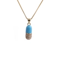 Close-up of a gold capsule pendant with light blue enamel and micro-pave zircons - Box Chain / Blue