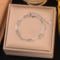 Polished silver paperclip link chain bracelet with adjustable lobster clasp on gift box - Cross Chain Bracelet / Steel
