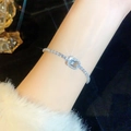 Silver tone zircon bracelet with square blue crystal stone on female wrist - Light Blue Crystal Square Bracelet (A2111)