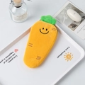 Close-up of bright orange plush carrot pencil case with green leaves and zipper - Large Capacity / Carrot