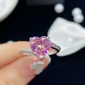 Macro close-up of a silver open ring with a large pink heart-shaped zircon gemstone - Adjustable Open / Pink Zirconia