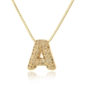 Detailed view of a gold letter A pendant necklace with sparkling cubic zirconia pavé - Letter A