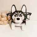 Detail shot of a handmade wooden husky dog eyeglasses holder on a white desk - Husky