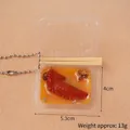 Miniature food keychain featuring realistic braised chicken wings in a tiny takeout box - Braised Wing Tips