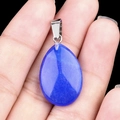 Polished blue quartz teardrop pendant with silver bail shown in hand for scale - Blue Jade (Dyed) (1pc)