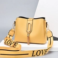 Yellow bucket bag with gold tassel detail and wide LOVE printed strap in PU leather - Yellow