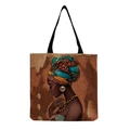 Detail of reusable canvas tote bag featuring vibrant African woman art and black strap - Afro Lady Portrait-Ethnic Style Turban