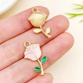 Pink dripping oil rose pendant in gold alloy for DIY jewelry held on fingertip - 23x13mm Single Rose