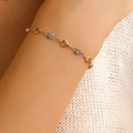 Elegant two-tone heart chain bracelet with clear crystals on a model wrist - Heart Rhinestone Bracelet (4655)