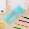 Detail of teal glitter stationery pouch with snap closure and iridescent translucent finish - Glittery Blue