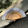 Classic folding fan with cherry blossom pattern and black tassels on gray-blue fabric - Natural Wood Grey Blue