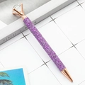 Sparkly purple glitter ballpoint pen with a large crystal diamond top and rose gold trim - Purple