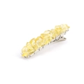 Detalle de piedras de cristal natural amarillo en un pasador de metal plateado - Citrino