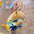 Plush capybara keychain wearing a colorful tropical Hawaiian shirt with a gold clasp - Vacation Capybara Blue Shirt
